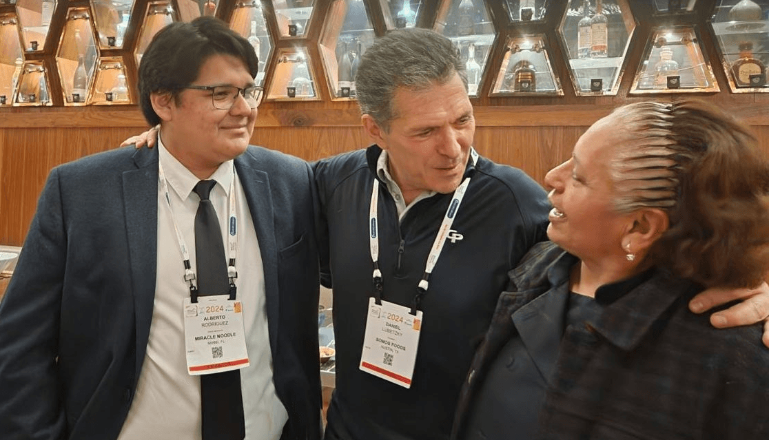 Meeting with industry leaders including Daniel Lubetzky at a professional event